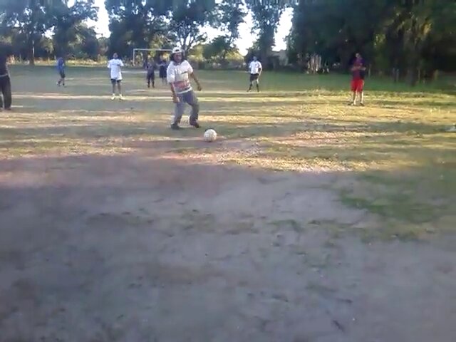 Man playing soccer falls down