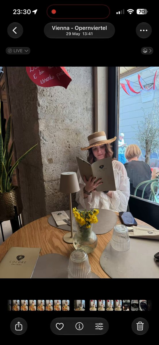 Woman Reading Menu at Cafe