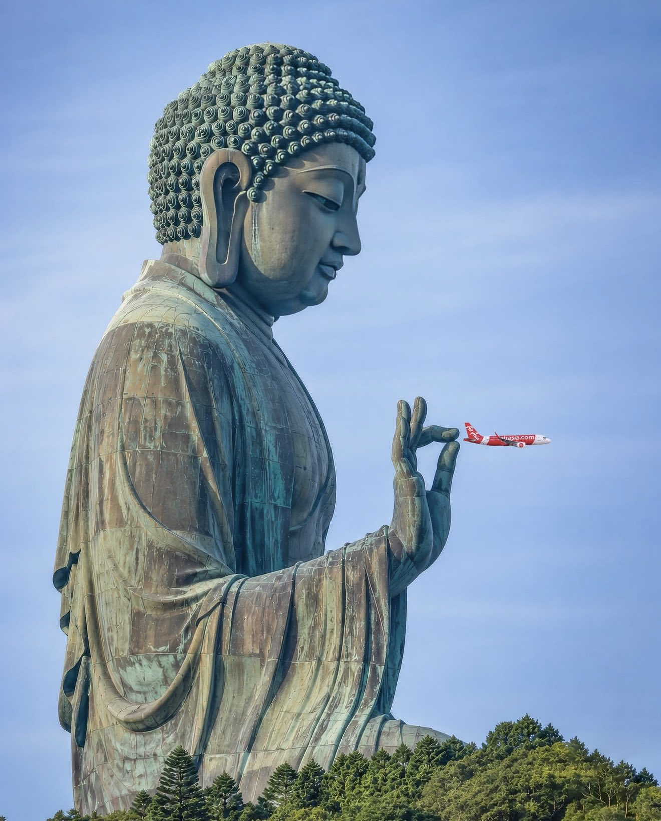 Buddha statue holds AirAsia plane