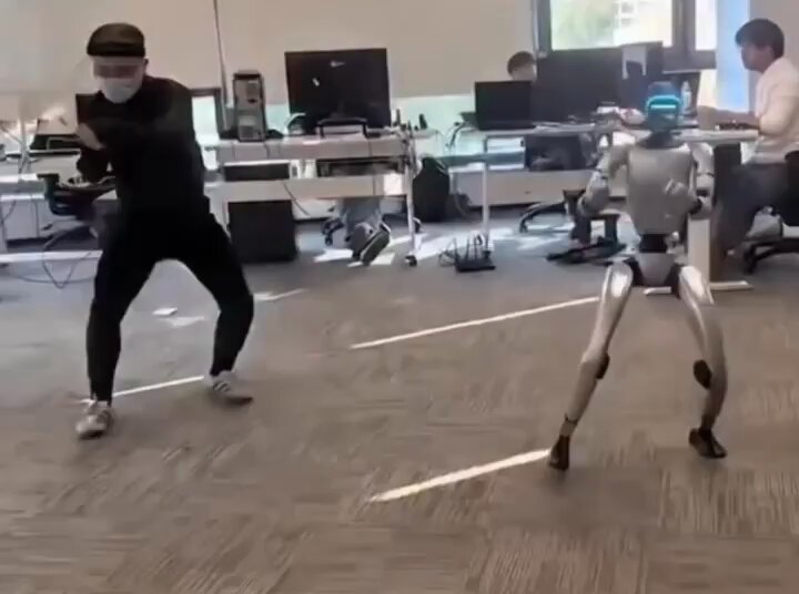 Human trains with Boston Dynamics Atlas robot