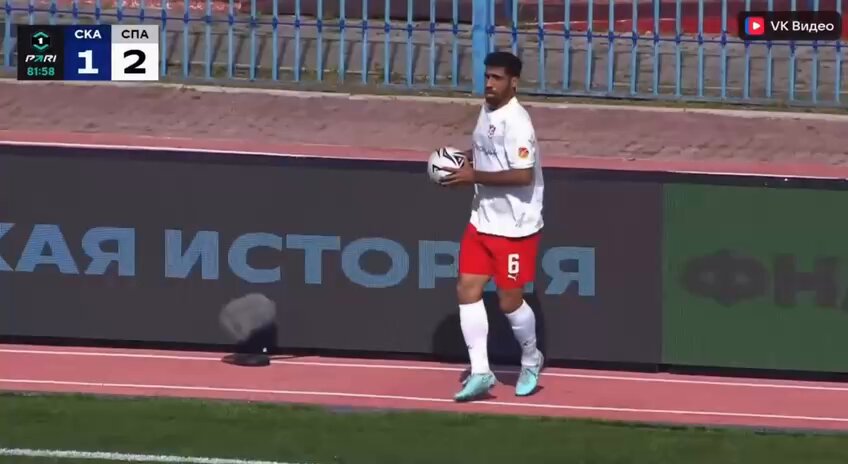 Footballer scores goal and celebrates