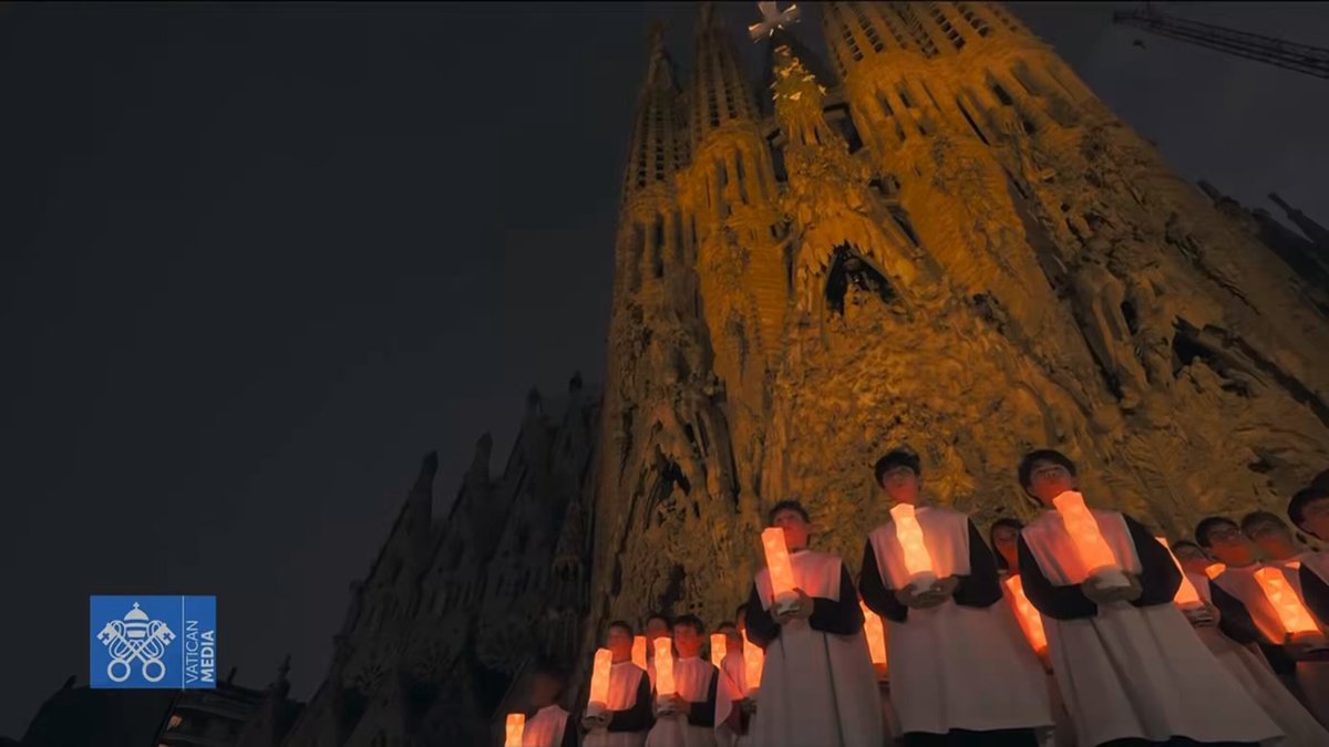 Sagrada Familia illuminated with drone show and orchestra
