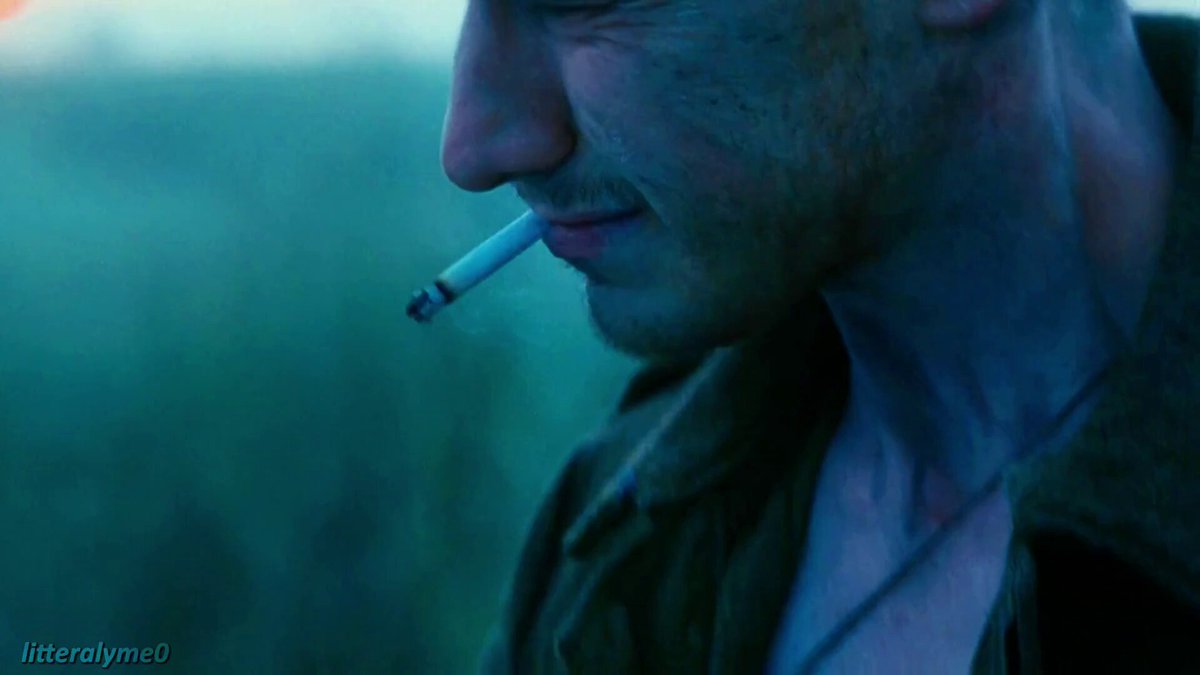 Man Smoking Cigarette at Sunset